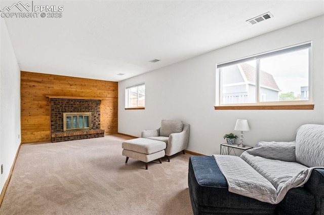 7350 Devinney Ct, Arvada, CO 80005 - carpeted living area featuring wood walls, baseboards, and a brick fireplace
