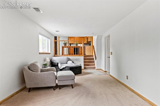 7350 Devinney Ct, Arvada, CO 80005 - living area with light carpet, stairs, and baseboards