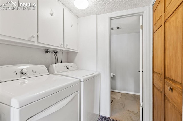 7350 Devinney Ct, Arvada, CO 80005 - laundry area featuring cabinet space, washer and dryer, and a textured ceiling