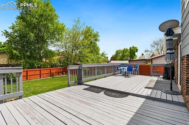 7350 Devinney Ct, Arvada, CO 80005 - wooden deck with outdoor dining area