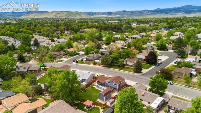 7350 Devinney Ct, Arvada, CO 80005 - aerial perspective of suburban area with a mountain backdrop