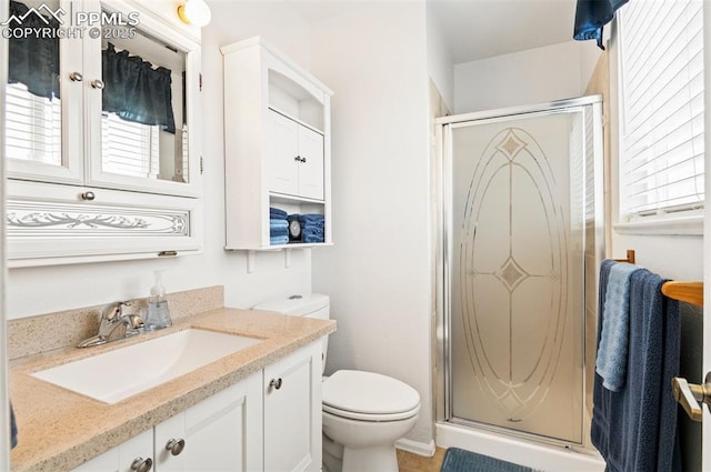 7350 Devinney Ct, Arvada, CO 80005 - full bathroom with toilet, a stall shower, and vanity