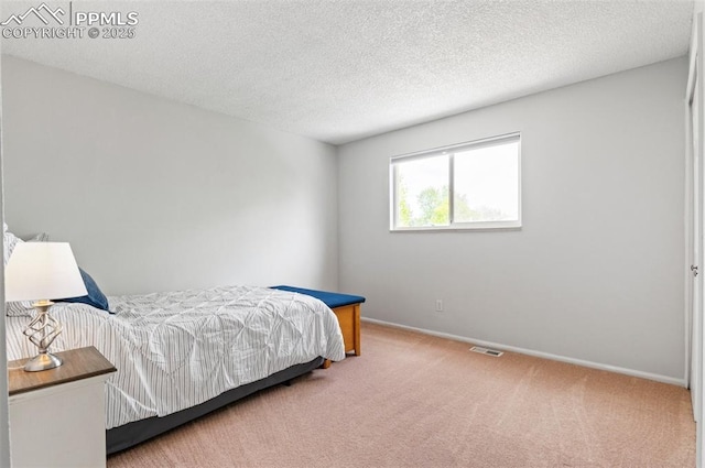 7350 Devinney Ct, Arvada, CO 80005 - bedroom featuring carpet, baseboards, and a textured ceiling