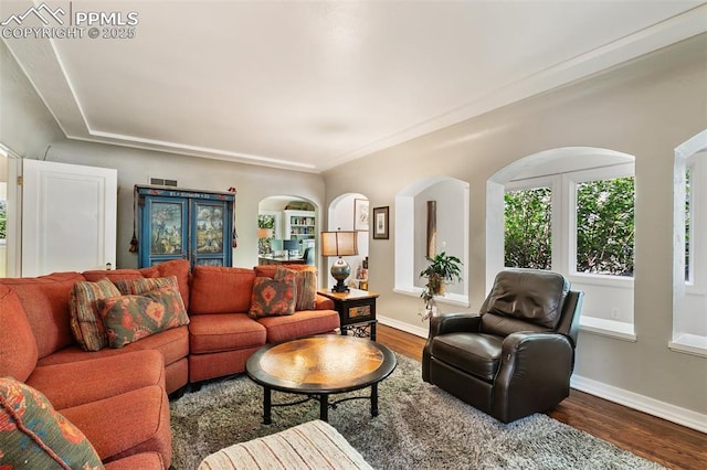 6 3rd St, Colorado Springs, CO 80906 - living room with dark wood-style floors, arched walkways, and baseboards