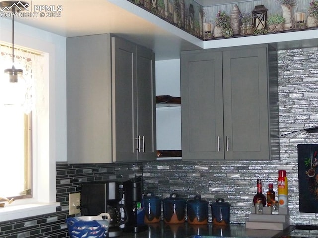 4307 Valli Vista Rd, Colorado Springs, CO 80915 - kitchen featuring gray cabinetry and tasteful backsplash