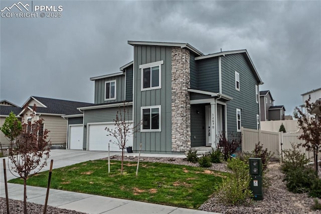 12670 Granite Ridge Dr, Peyton, CO 80831 - view of front of home featuring board and batten siding, driveway, and a garage