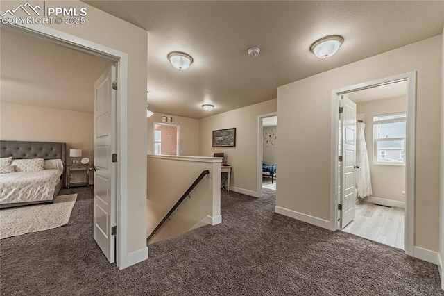 12670 Granite Ridge Dr, Peyton, CO 80831 - hallway featuring an upstairs landing, carpet floors, and baseboards