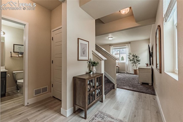 12670 Granite Ridge Dr, Peyton, CO 80831 - entrance foyer with stairway, light wood-style flooring, and baseboards