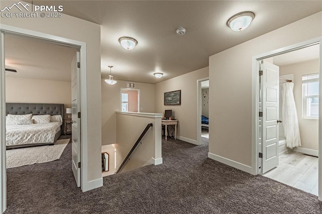 12670 Granite Ridge Dr, Peyton, CO 80831 - hallway featuring an upstairs landing, carpet flooring, and baseboards