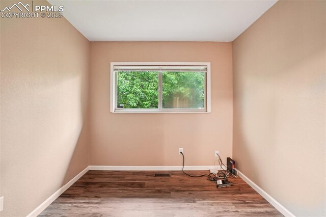 27 Stovel Cir, Colorado Springs, CO 80916 - empty room with baseboards and wood finished floors