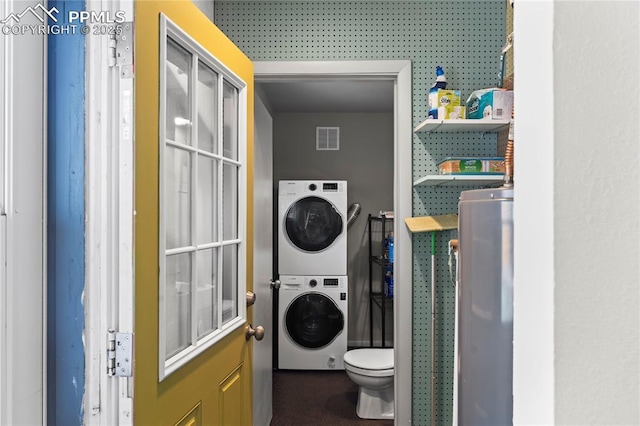 2321 N Meade Ave, Colorado Springs, CO 80907 - laundry room with stacked washer / drying machine and water heater