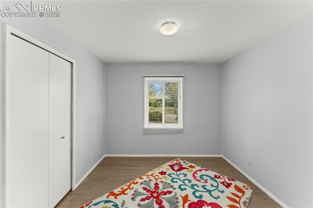 2321 N Meade Ave, Colorado Springs, CO 80907 - bedroom with baseboards, wood finished floors, and a closet