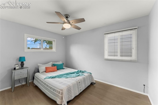 2321 N Meade Ave, Colorado Springs, CO 80907 - bedroom with baseboards, wood finished floors, and a ceiling fan