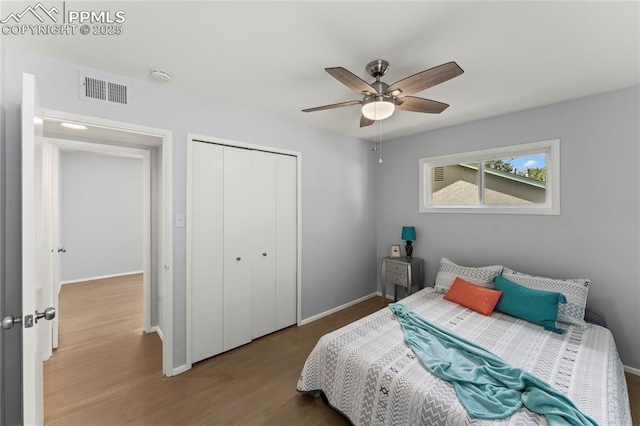 2321 N Meade Ave, Colorado Springs, CO 80907 - bedroom with wood finished floors, a closet, baseboards, and ceiling fan
