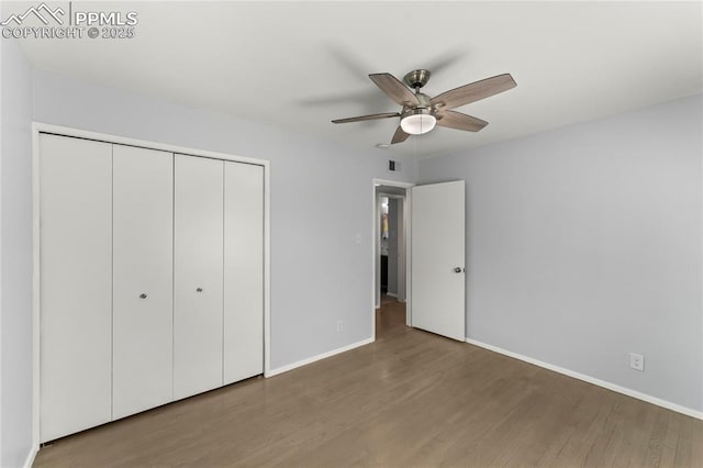 2321 N Meade Ave, Colorado Springs, CO 80907 - unfurnished bedroom with wood finished floors, a closet, baseboards, and ceiling fan