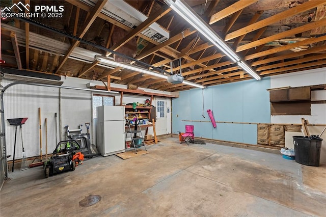 2321 N Meade Ave, Colorado Springs, CO 80907 - garage featuring freestanding refrigerator and a garage door opener