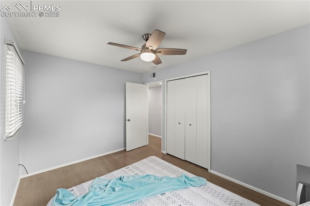 2321 N Meade Ave, Colorado Springs, CO 80907 - bedroom with wood finished floors, baseboards, and a closet