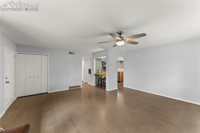 2321 N Meade Ave, Colorado Springs, CO 80907 - unfurnished living room with a ceiling fan, wood finished floors, and baseboards