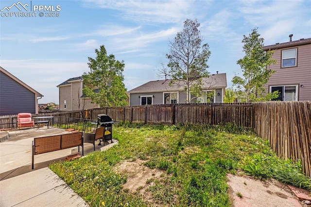 7526 Gallard Hts, Peyton, CO 80831 - fenced backyard featuring a patio area and an outdoor living space
