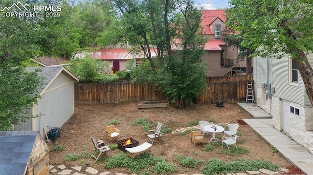 817 W Kiowa St, Colorado Springs, CO 80905 - fenced backyard with an outdoor fire pit
