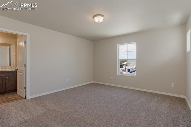 5216 Devers Ct, Colorado Springs, CO 80925 - unfurnished room featuring light carpet and baseboards