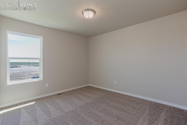 5216 Devers Ct, Colorado Springs, CO 80925 - carpeted empty room featuring baseboards