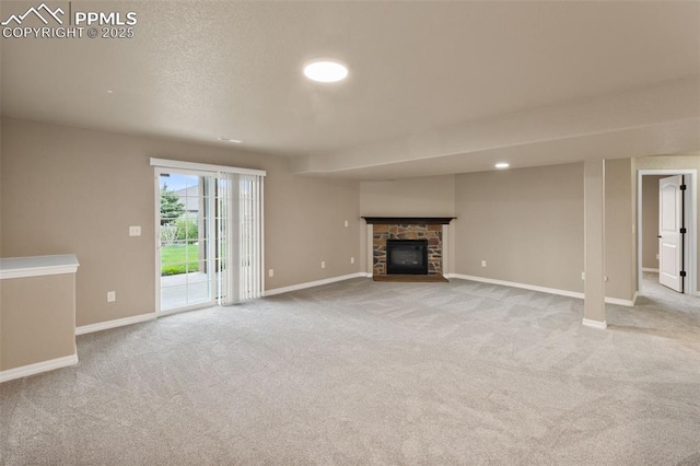 8059 Cinnamon Ct, Colorado Springs, CO 80927 - unfurnished living room with carpet floors, a fireplace, and baseboards