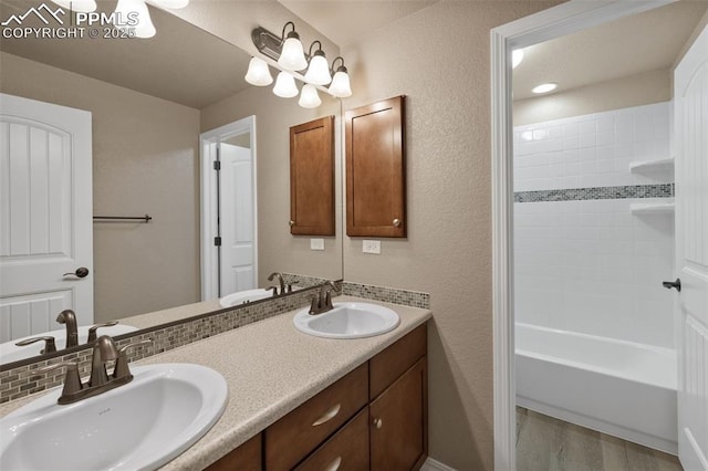 8059 Cinnamon Ct, Colorado Springs, CO 80927 - bathroom featuring double vanity and shower / bathtub combination