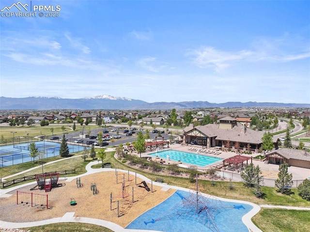 8059 Cinnamon Ct, Colorado Springs, CO 80927 - aerial perspective of suburban area with a mountain backdrop and a pool