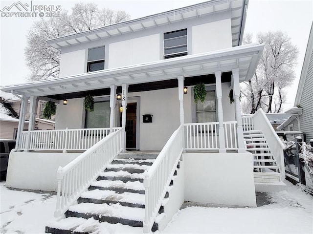 18 S 13th St, Colorado Springs, CO 80904 - view of front of home featuring covered porch, stairs, and stucco siding