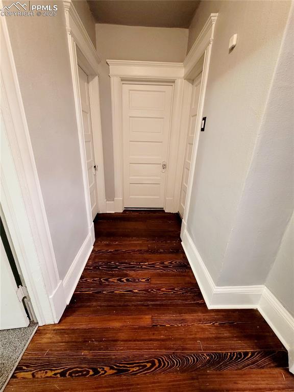 18 S 13th St, Colorado Springs, CO 80904 - corridor featuring dark wood finished floors and baseboards