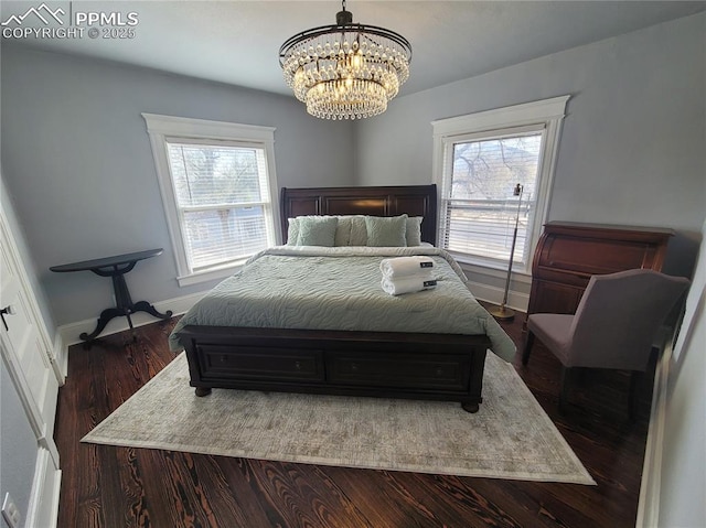 18 S 13th St, Colorado Springs, CO 80904 - bedroom featuring multiple windows, a chandelier, dark wood finished floors, and baseboards