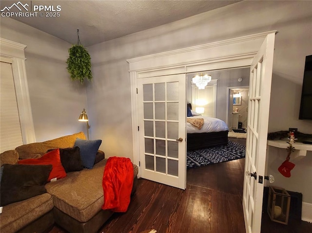 18 S 13th St, Colorado Springs, CO 80904 - bedroom with dark wood-type flooring and a chandelier