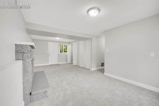 2201 Sonoma Dr, Colorado Springs, CO 80910 - unfurnished living room with carpet floors, baseboards, and a fireplace