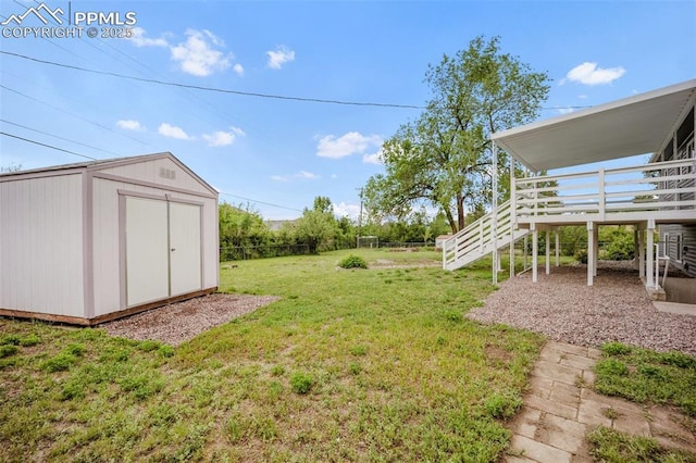 2201 Sonoma Dr, Colorado Springs, CO 80910 - view of yard featuring a deck and stairs