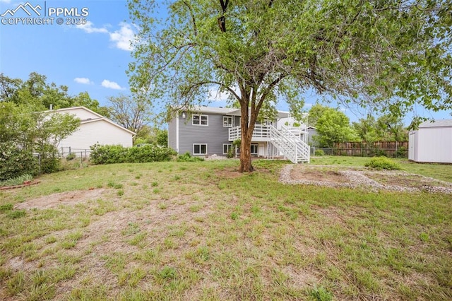 2201 Sonoma Dr, Colorado Springs, CO 80910 - view of yard featuring stairs and an outbuilding