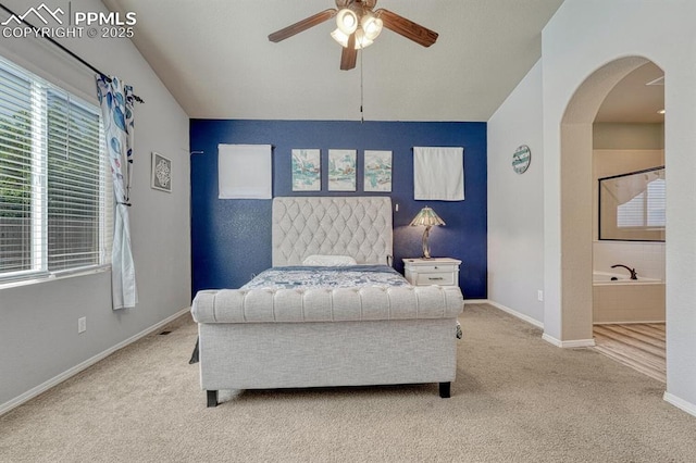 8055 Mount Hayden Dr, Colorado Springs, CO 80924 - bedroom featuring carpet, arched walkways, and ceiling fan
