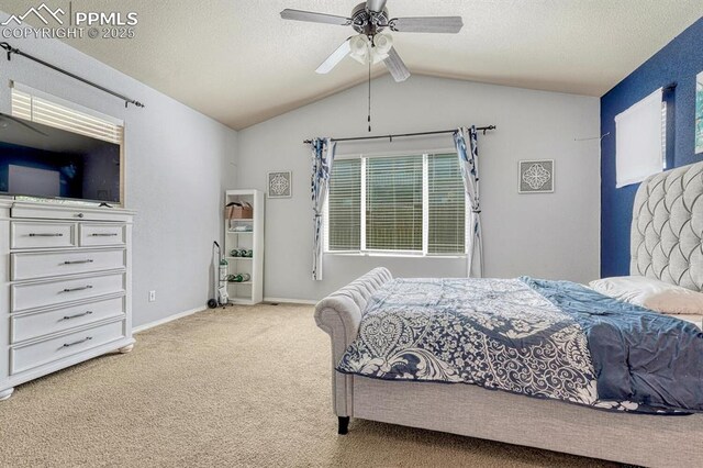 8055 Mount Hayden Dr, Colorado Springs, CO 80924 - carpeted bedroom featuring vaulted ceiling, a textured ceiling, and a ceiling fan