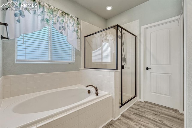 8055 Mount Hayden Dr, Colorado Springs, CO 80924 - bathroom with a bath, a shower stall, and plenty of natural light