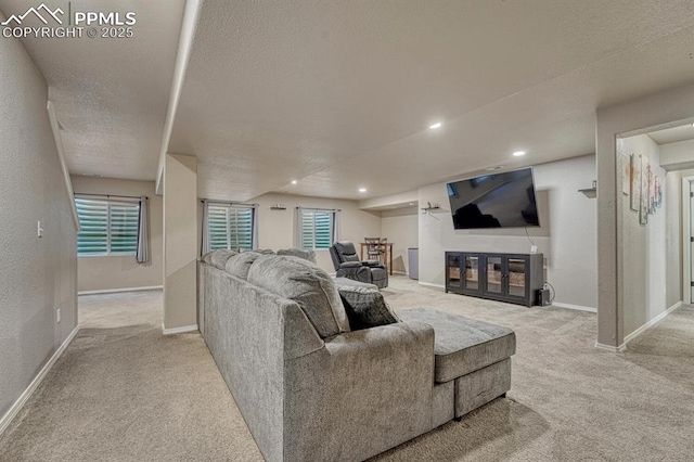 8055 Mount Hayden Dr, Colorado Springs, CO 80924 - carpeted living area with a textured ceiling and recessed lighting