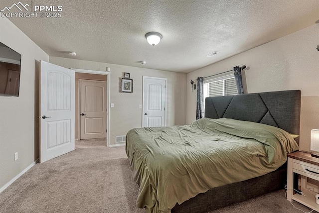 8055 Mount Hayden Dr, Colorado Springs, CO 80924 - carpeted bedroom featuring a textured ceiling and baseboards