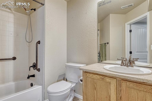 8055 Mount Hayden Dr, Colorado Springs, CO 80924 - bathroom featuring a textured wall, vanity, and washtub / shower combination