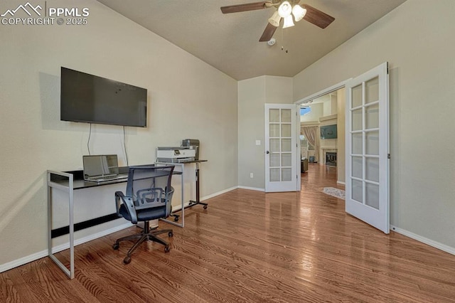 8055 Mount Hayden Dr, Colorado Springs, CO 80924 - home office with french doors, wood finished floors, and ceiling fan