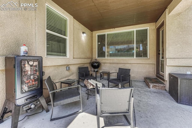 8055 Mount Hayden Dr, Colorado Springs, CO 80924 - view of patio / terrace with a fire pit