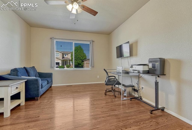 8055 Mount Hayden Dr, Colorado Springs, CO 80924 - office space featuring wood finished floors and a ceiling fan