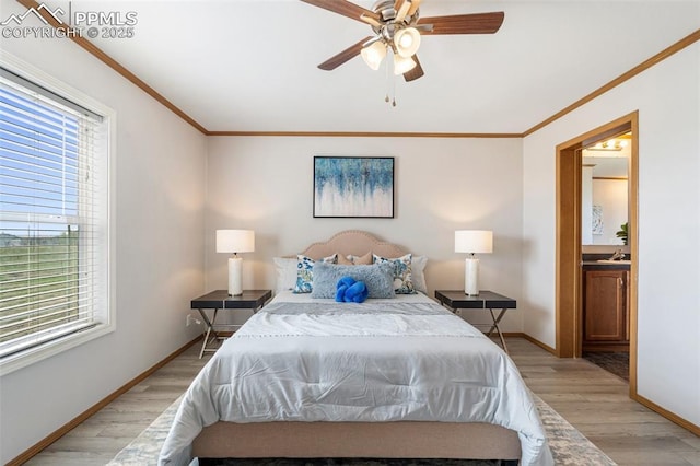 1134 Buffalo Run Rd, Calhan, CO 80808 - bedroom featuring light wood finished floors, baseboards, ornamental molding, connected bathroom, and ceiling fan