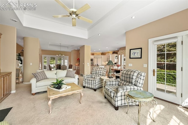 3479 Hill Cir, Colorado Springs, CO 80904 - living room featuring a tray ceiling, ceiling fan, light carpet, ornamental molding, and recessed lighting
