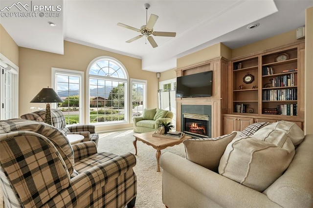 3479 Hill Cir, Colorado Springs, CO 80904 - carpeted living room featuring a glass covered fireplace, ceiling fan, and crown molding