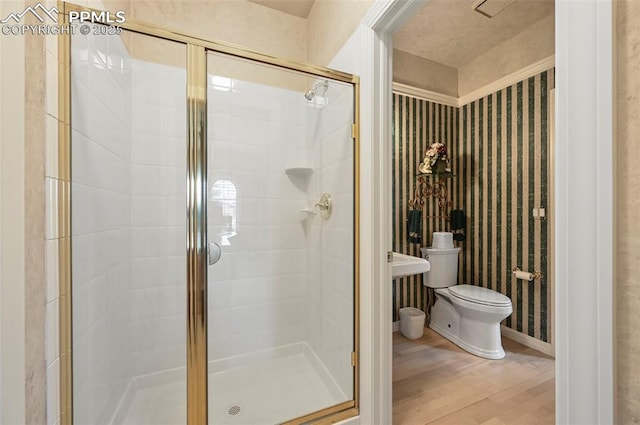 3479 Hill Cir, Colorado Springs, CO 80904 - bathroom featuring a stall shower and wood finished floors