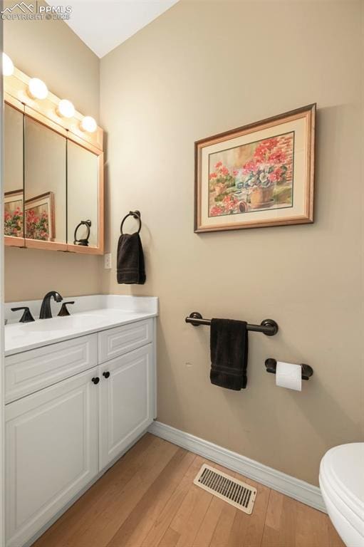 3479 Hill Cir, Colorado Springs, CO 80904 - bathroom featuring vanity and wood finished floors